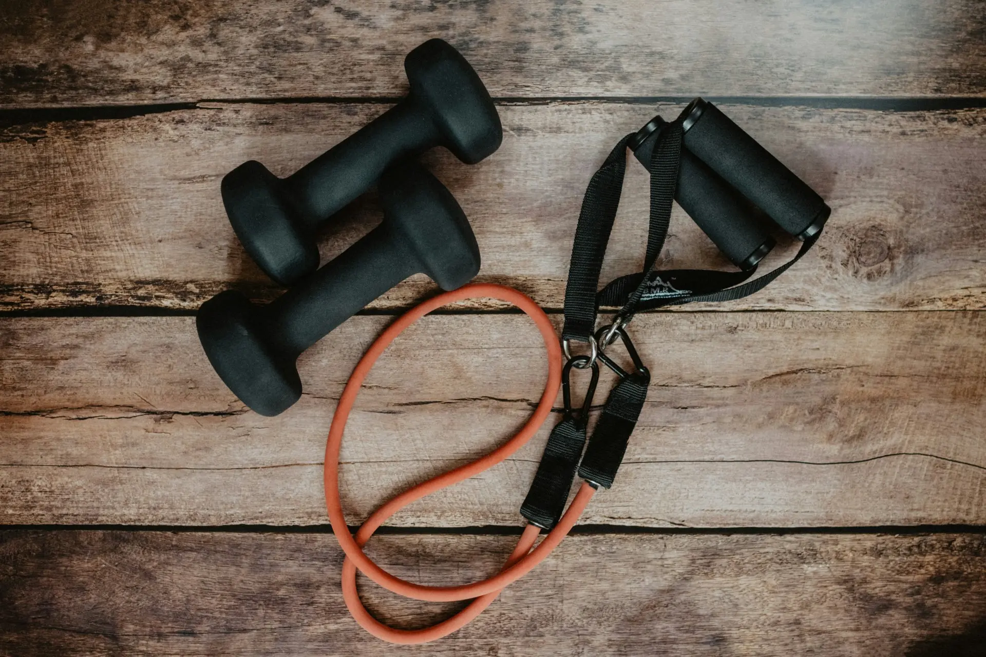 High-quality sport equipment for fitness enthusiasts, including dumbbells, kettlebells, and resistance bands for strength training.