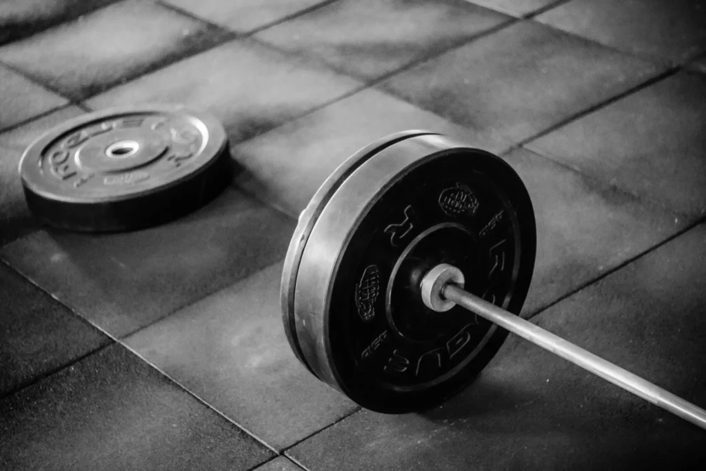 Fitness enthusiast exploring complete supplement packs for strength and endurance at the gym.