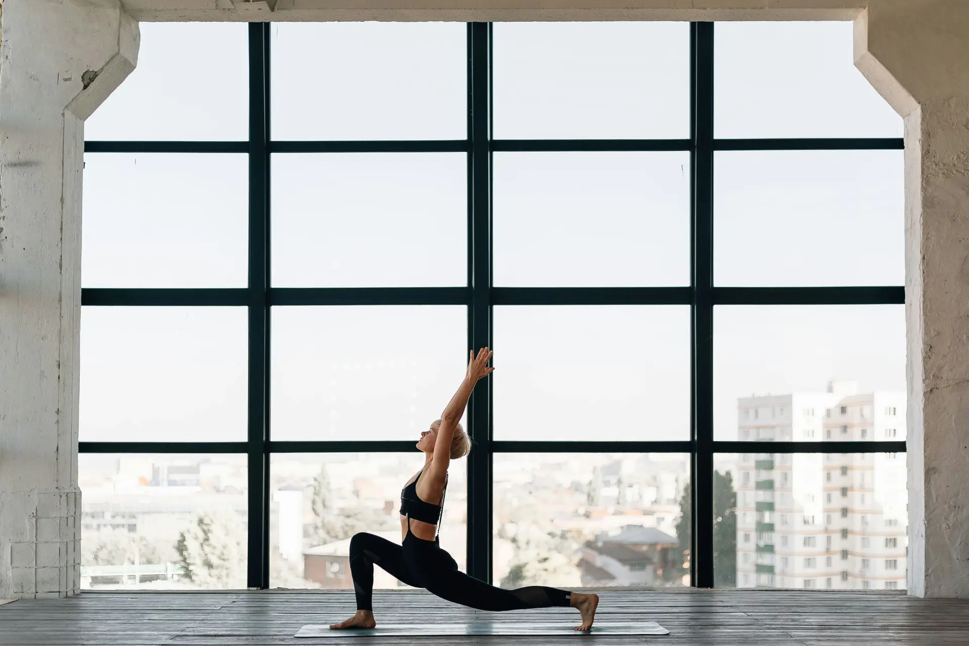 Young woman practicing self-care and focusing on her wellness journey with a peaceful and determined expression.